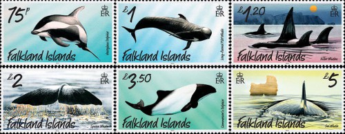 Серия почтовых марок с дельфинами и китами